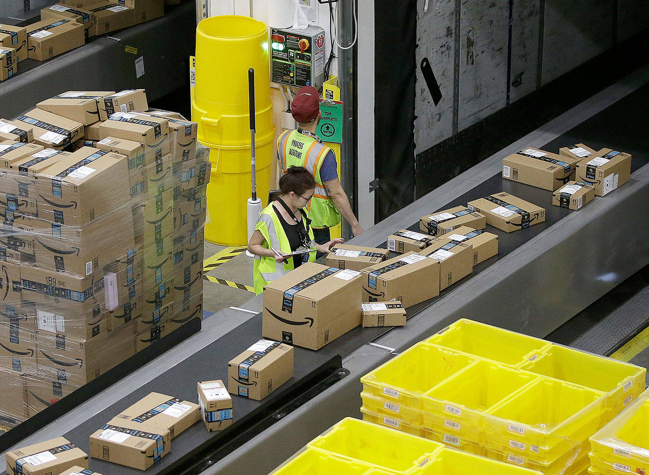 Packages move down a conveyor system were they are directed to the proper shipping area at the new Amazon Fulfillment Center in Sacramento, California, in 2018. Cyber Monday is still holding up as the biggest online shopping day of the year. (AP Photo/Rich Pedroncelli, File)