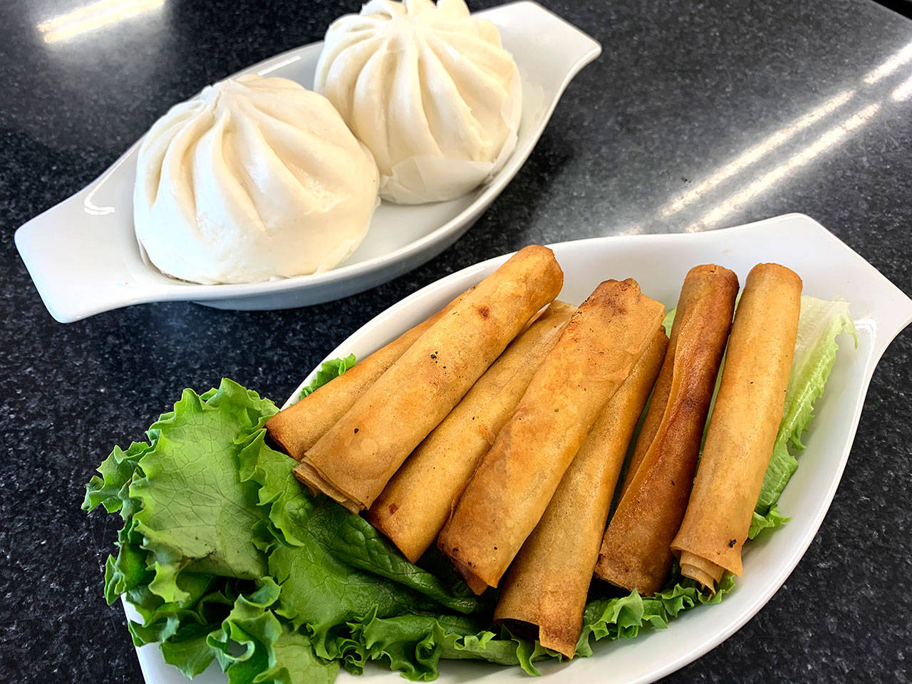 Siopao and lumpias are two Philippine staples on the menu at Gracie’s Cuisine in Everett. (Evan Thompson / The Herald)