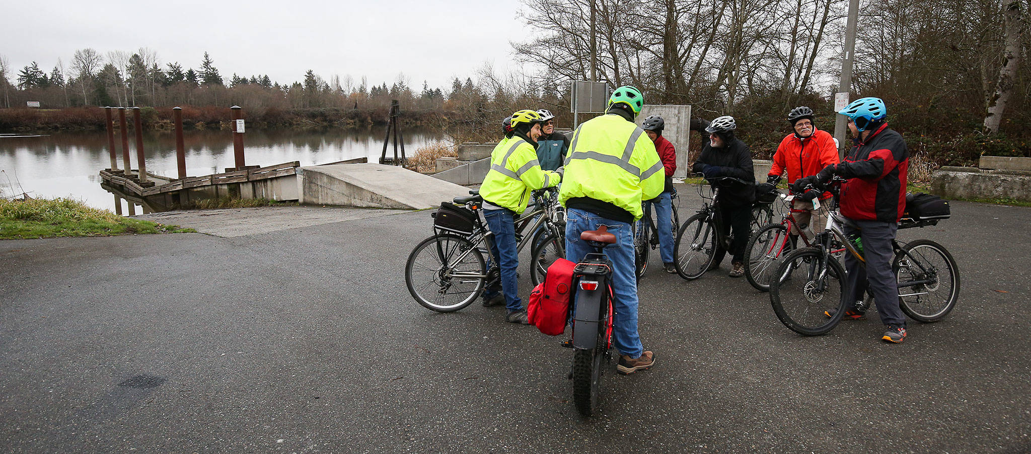 A group of bikers stop for a break by Rotary Park’s boat launch on Monday in Everett. The popular boat launch and park along the Snohomish River is set to get a $400,000 makeover. (Andy Bronson / The Herald)