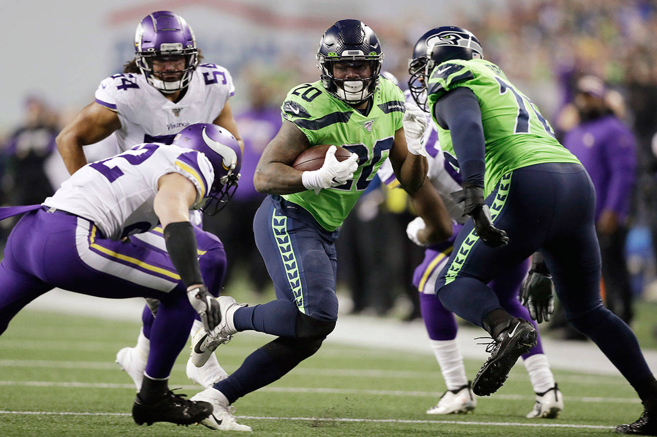 Seattle’s Rashaad Penny (20) runs the ball during the Seahawks’ 37-30 win over Minnesota on Monday in Seattle. (AP Photo/John Froschauer)