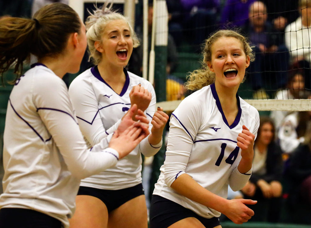 Samaya Morin (center) celebrates a point with her teammates during the Vikings’ state-clinching bi-district tournament sweep of Mount Si earlier this month. (Kevin Clark / The Herald)
