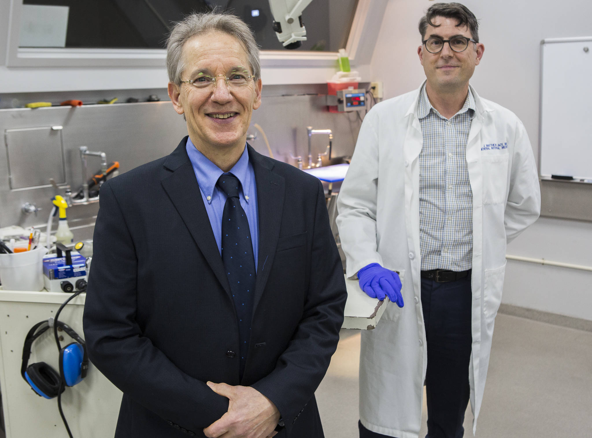 Outgoing medical examiner Dr. Daniel Selove (left) and incoming medical examiner Dr. J. Matthew Lacy (right) at the Snohomish County Medical Examiner’s Office on Dec. 4 in Everett. (Olivia Vanni / The Herald)