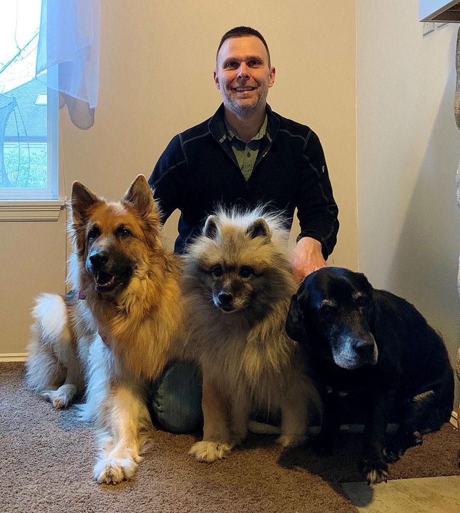 Matt Kaeberlein, helping to lead the University of Washington dog study, has three pooches, himself. They are Dobby, 8, Chloe, 14, and Betty, who is a rescue and likely is 13-15 years old. (Family photo)
