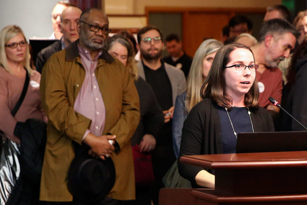 Rachel Wilkinson Downes, Housing Hope grant manager, addresses the council Wednesday evening at Everett City Hall. (Kevin Clark / The Herald)
