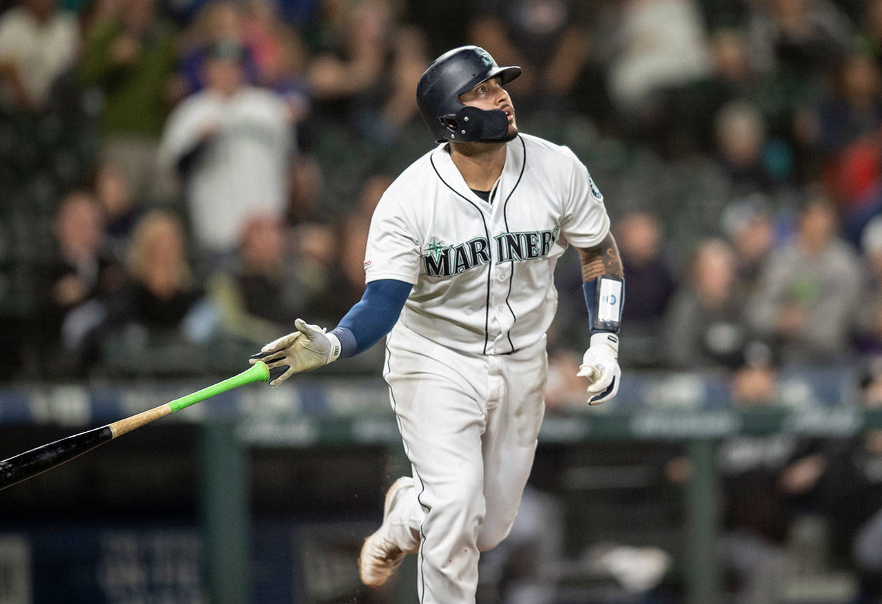 Seattle’s Omar Narvaez tosses his bat after hitting a solo home run off Chicago White Sox relief pitcher Alex Colome during a game in September. The Milwaukee Brewers acquired Narvaez from the Mariners on Thursday. (AP Photo/Stephen Brashear, File)