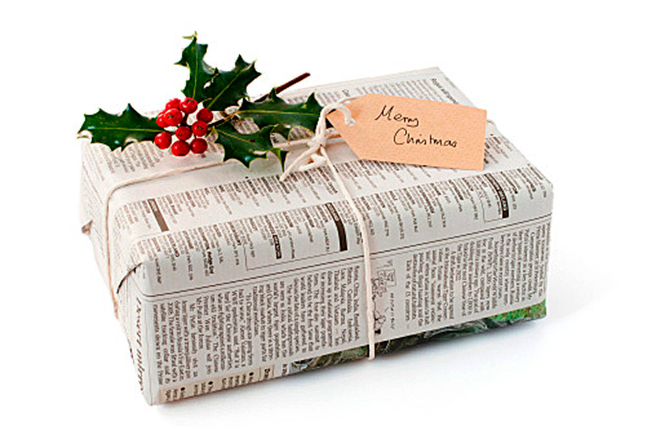 Tip: Wrap presents with reusable materials like newspaper or last year’s gift bags and bows. (Getty Images)