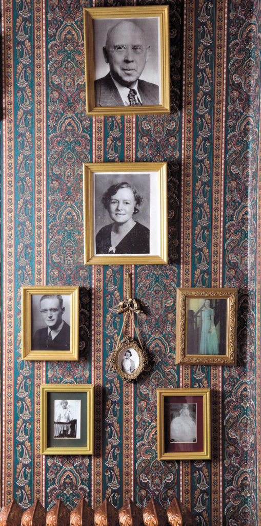Photographs of the Wright family, who lived in the Hensell home for two decades, hang in the foyer. (Andy Bronson / The Herald)

