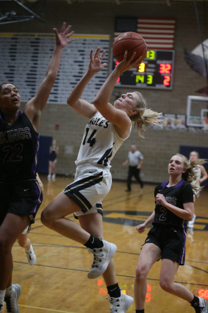 Arlington’s Keira Marsh drives in for a layup as the Arlington Eagles lost to the Lake Stevens Vikings 57-54 in a girls’ basketball game on Friday, Dec. 6, 2019 in Arlington, Wash. (Andy Bronson / The Herald)
