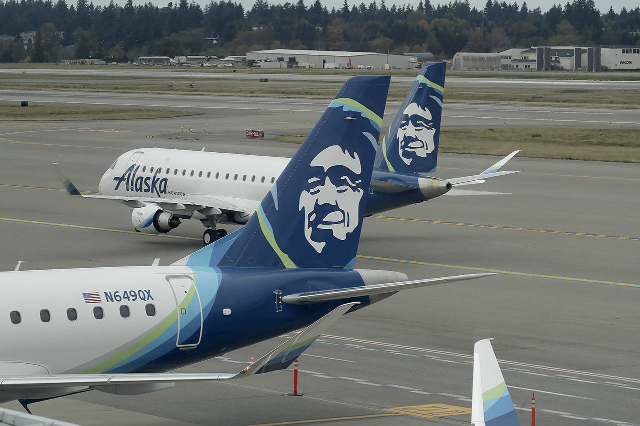 A passenger plane with Horizon Air taxis at Seattle-Tacoma International Airport in Seattle on Oct. 7. (AP Photo/Ted S. Warren, file)