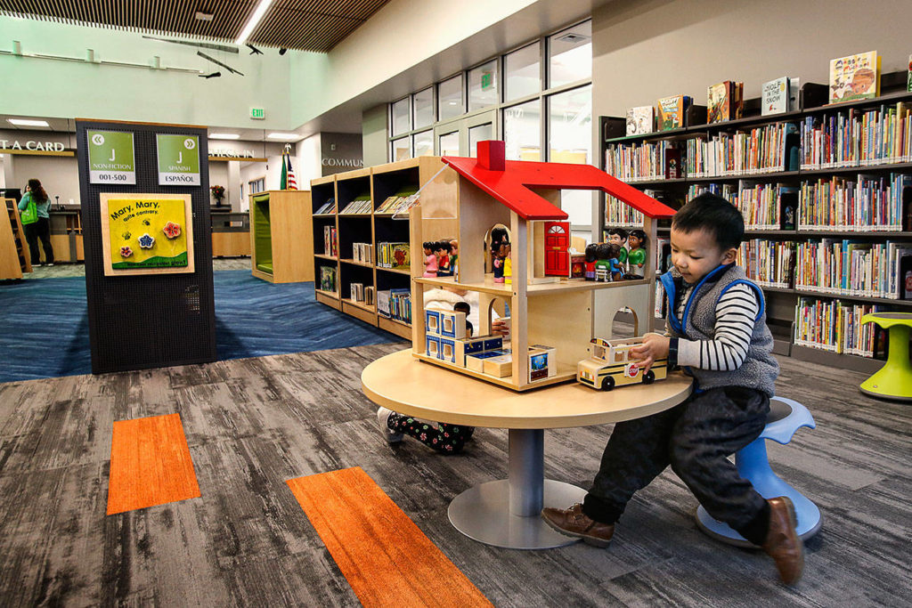 Spacious children’s areas include accessible rooms for games and learning as well as uncluttered space where parents can easily watch or read with their kids. (Dan Bates / The Herald)
