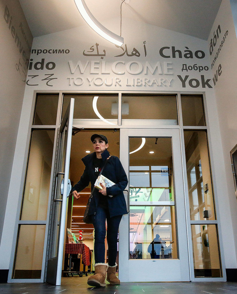 “Welcome to Your Library” is expressed in several languages above the doorway at the newly renovated Evergreen Branch of the Everett Public Library. (Dan Bates / The Herald)
