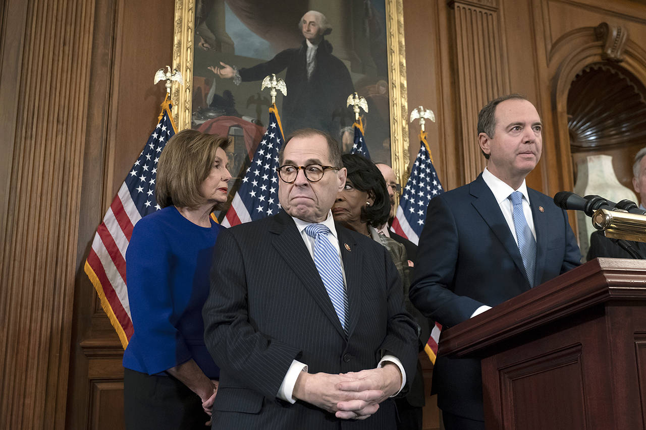 From left, Speaker of the House Nancy Pelosi, House Judiciary Committee Chairman Jerrold Nadler, House Financial Services Committee Chairwoman Maxine Waters, House Foreign Affairs Committee Chairman Eliot Engel, and House Intelligence Committee Chairman Adam Schiff announce they are pushing ahead with two articles of impeachment against President Donald Trump on Tuesday. (AP Photo/J. Scott Applewhite)