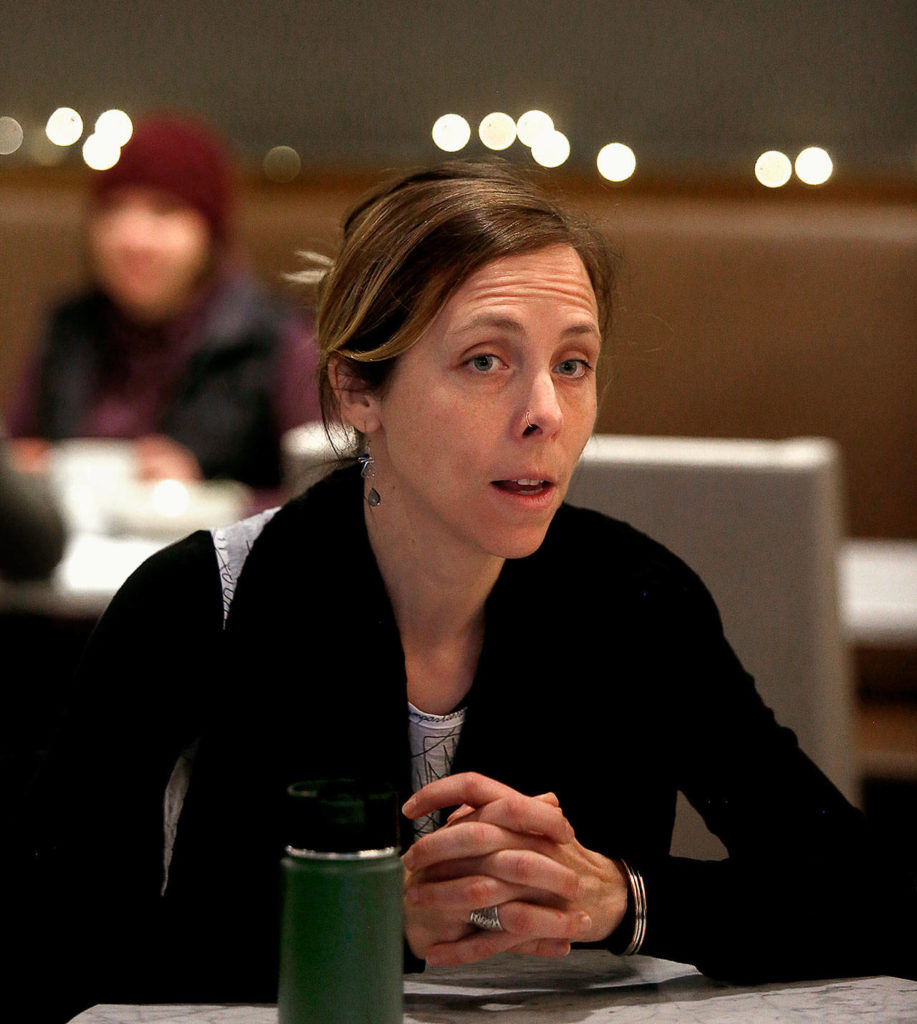 Kristen Kosidowski, director of food service and training for HopeWorks, talks about the agency’s new Kindred Kitchen Friday during the cafe grand opening. The restaurant will provide job skills for young people. (Dan Bates / The Herald)
