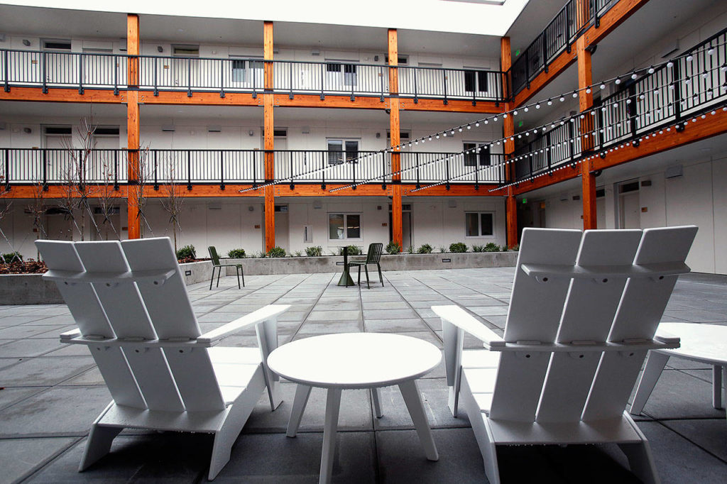 The 65-unit apartment complex that is part of HopeWorks Station on Broadway in Everett is designed around a secure, comfortable courtyard. Many of its residents are people working to turn their lives around. The apartments are upstairs from the new Kindred Kitchen. (Dan Bates / The Herald)
