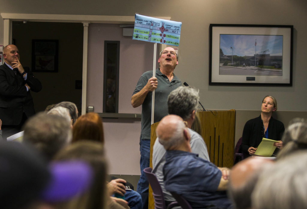 Doug Crawford explains a diagram he drew to illustrate the potential traffic back up from a Costco being built during the Lake Stevens City Council meeting on Tuesday. (Olivia Vanni / The Herald)
