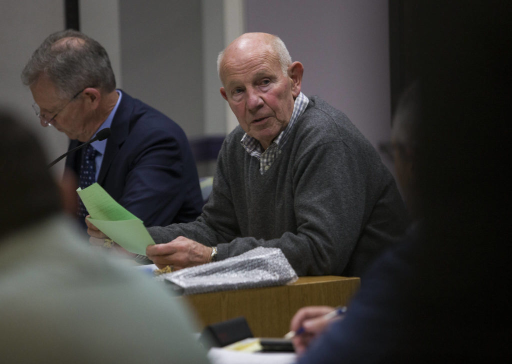 Lake Stevens Mayor John Spencer reads names of people signed up to speak during the Lake Stevens City Council meeting on Tuesday. (Olivia Vanni / The Herald)

