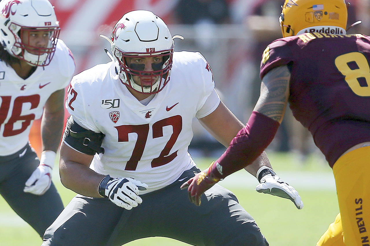 Washington State offensive lineman Abraham Lucas (72) earned second-team All-Pac-12 honors for the second consecutive season. Lucas is a graduate of Archbishop Murphy High School in Everett. (Ross D. Franklin / Associated Press)