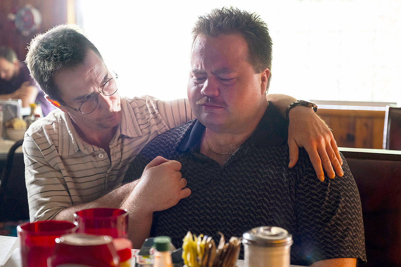 A lawyer (Sam Rockwell, left) counsels his client, besieged security guard Richard Jewell (Paul Walter Hauser), in Clint Eastwood’s “Richard Jewell.” (Warner Bros. Pictures)