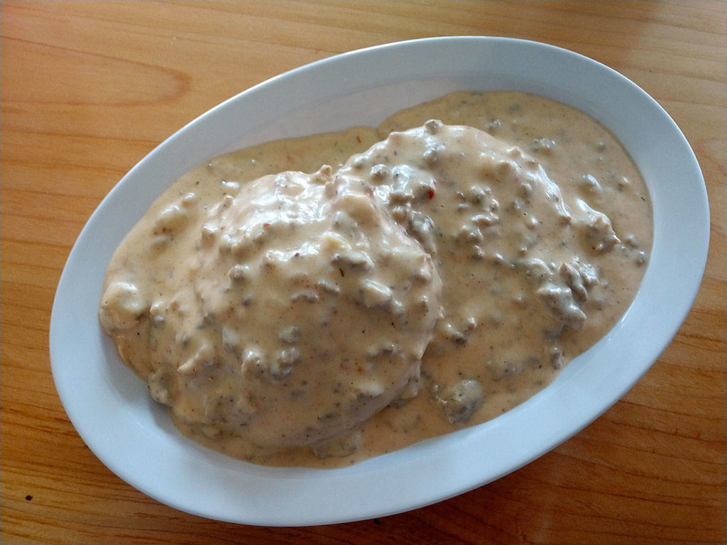 Biscuits and gravy at Biscuit and Bean is your choice of Uli’s breakfast sausage or mushroom leek gravy over a buttermilk or cheddar onion biscuit. (Sara Bruestle/The Herald)
