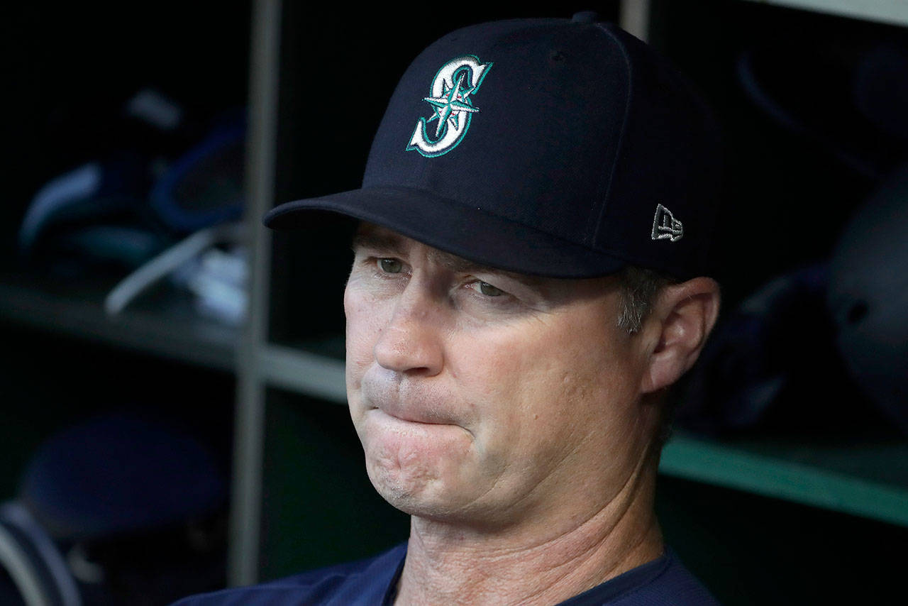 Mariners manager Scott Servais stands in the dugout before a game against the Pirates on Sept. 17, 2019, in Pittsburgh. (AP Photo/Gene J. Puskar)