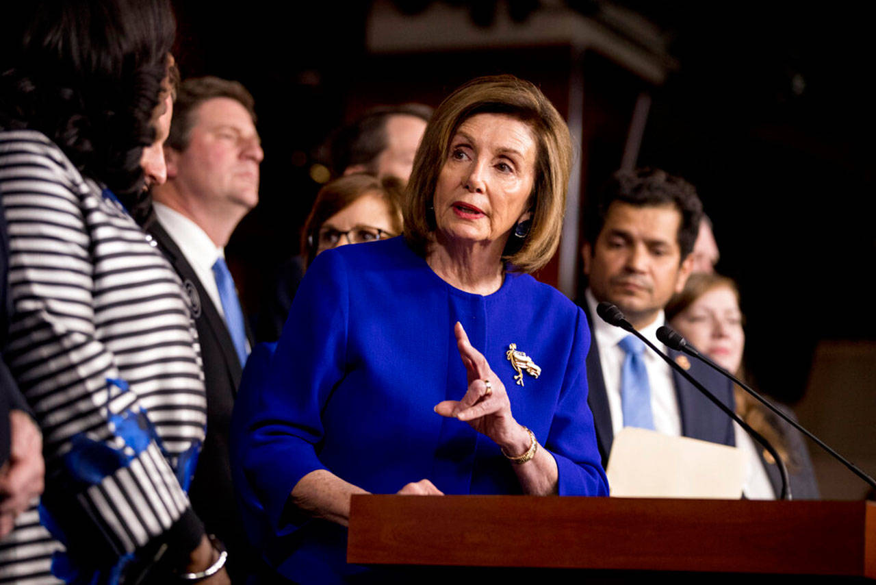 House Speaker Nancy Pelosi, D-California, accompanied by Democratic House members speaks at a news conference to discuss the United States-Mexico Canada-Agreement on trade, Tuesday on Capitol Hill in Washington. (Andrew Harnik / Associated Press)