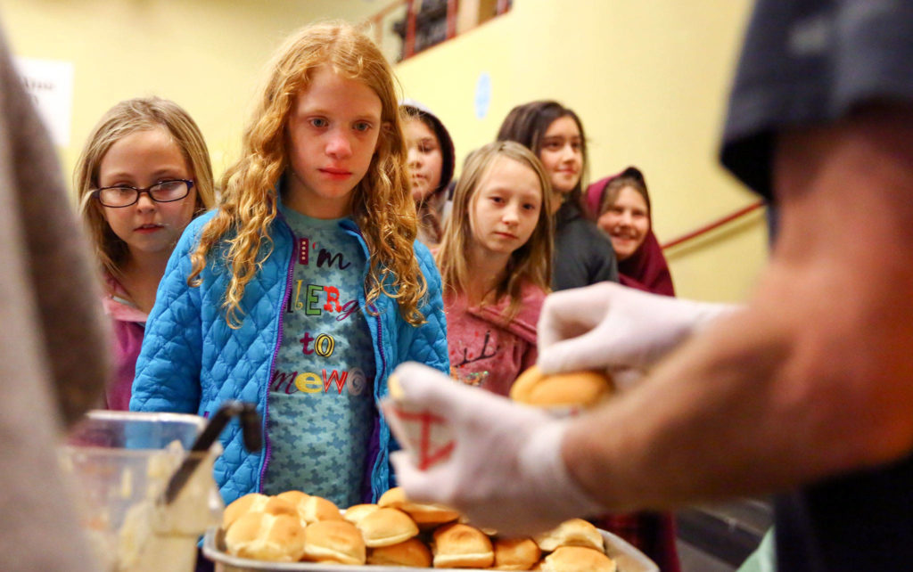 “This made my day,” one student exclaimed as he stood in line for the hot meal. (Kevin Clark / The Herald)
