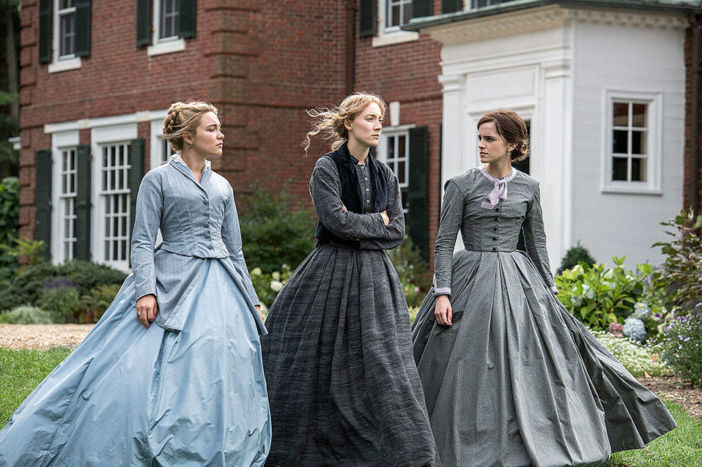 Florence Pugh as Amy, Saoirse Ronan as Jo and Emma Watson as Meg in a scene from “Little Women.” (Wilson Webb/Sony Pictures)
