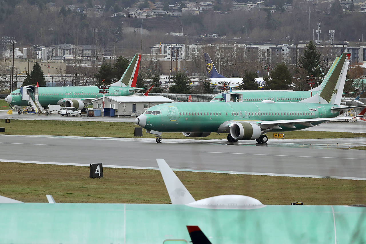 A Boeing 737 Max airplane being built for Norwegian Air International taxis for a test flight Wednesday at Renton Municipal Airport. (AP Photo/Ted S. Warren)