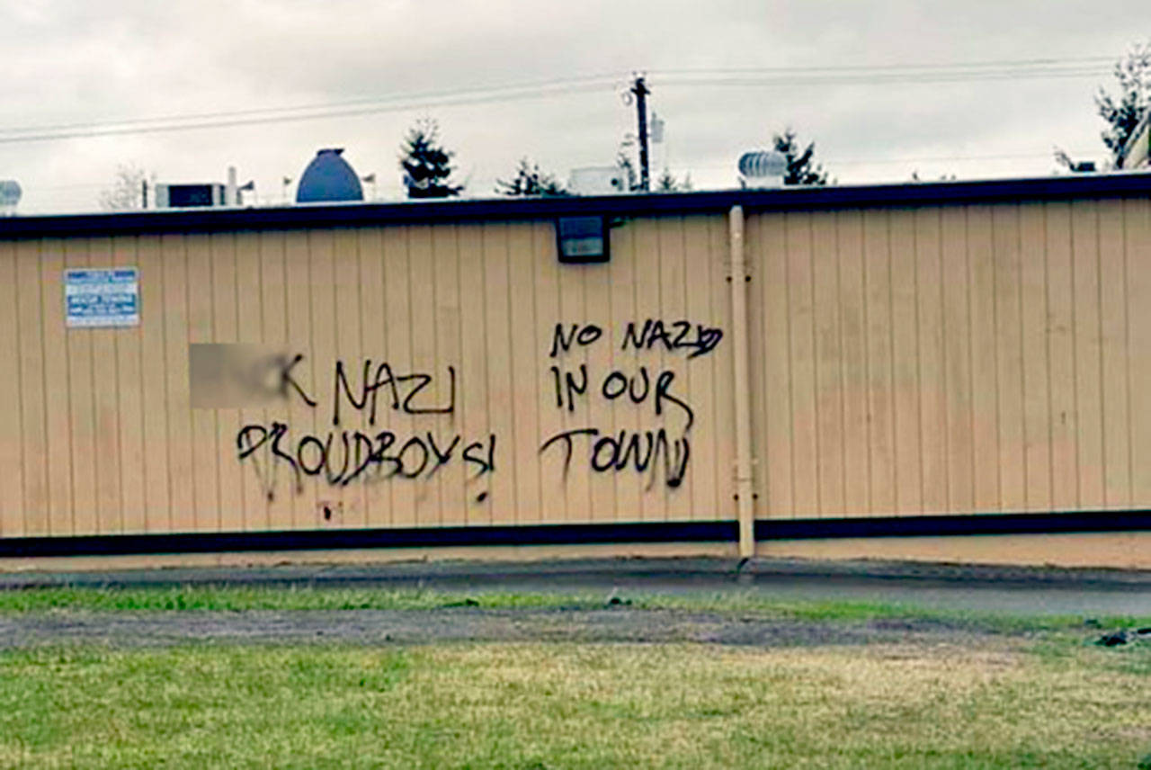 An anonymously submitted photo posted to Twitter shows graffiti on the wall of Razzals Sports Bar & Grill in Lake Stevens. Part of this image has been manipulated by The Herald to obscure an obscenity. (Emerald City Anti-fascists via Twitter)