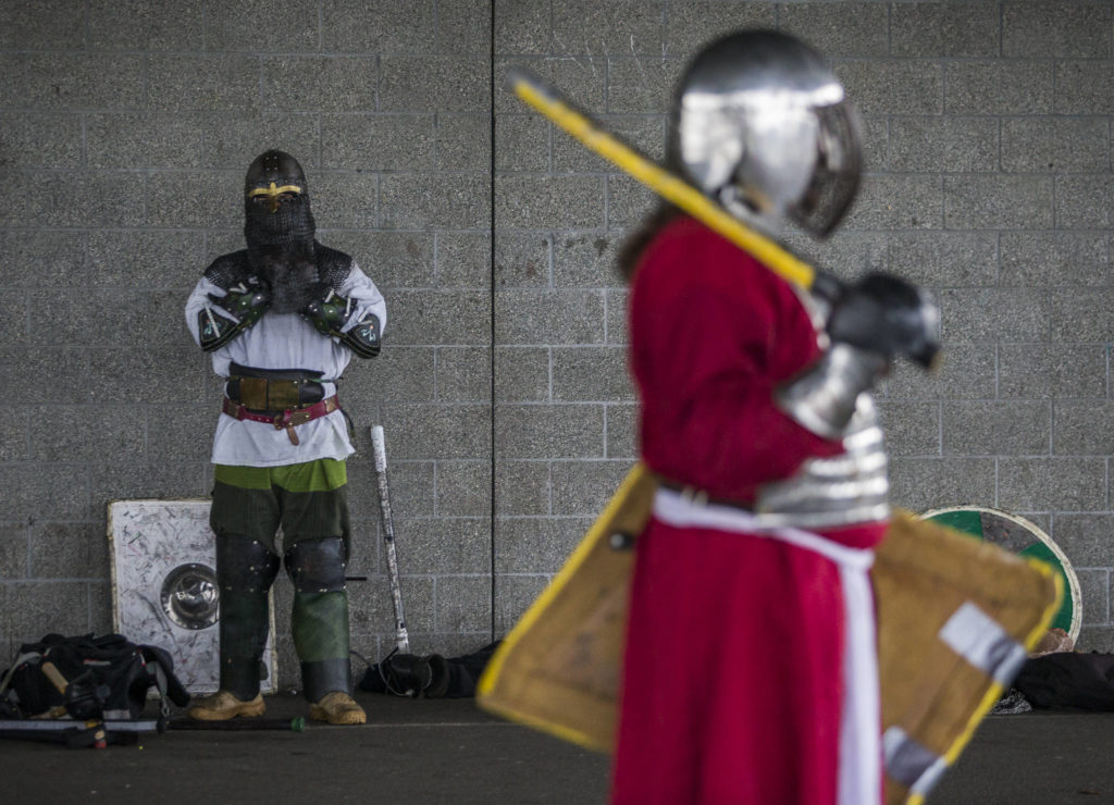 Derek Stump puts on his armor before combat practice. LARPers from around Washington will converge on the Evergreen State Fairgrounds on Jan. 25-26 for the Ursulmas Medieval Faire. (Olivia Vanni / The Herald)

