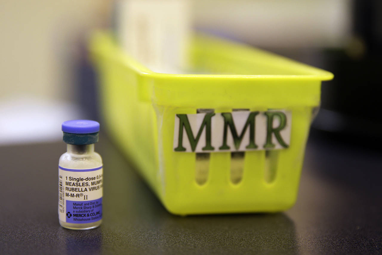 This 2015 photo, shows a measles, mumps and rubella vaccine on a countertop at a pediatrics clinic in Greenbrae, California. (AP Photo/Eric Risberg, File)