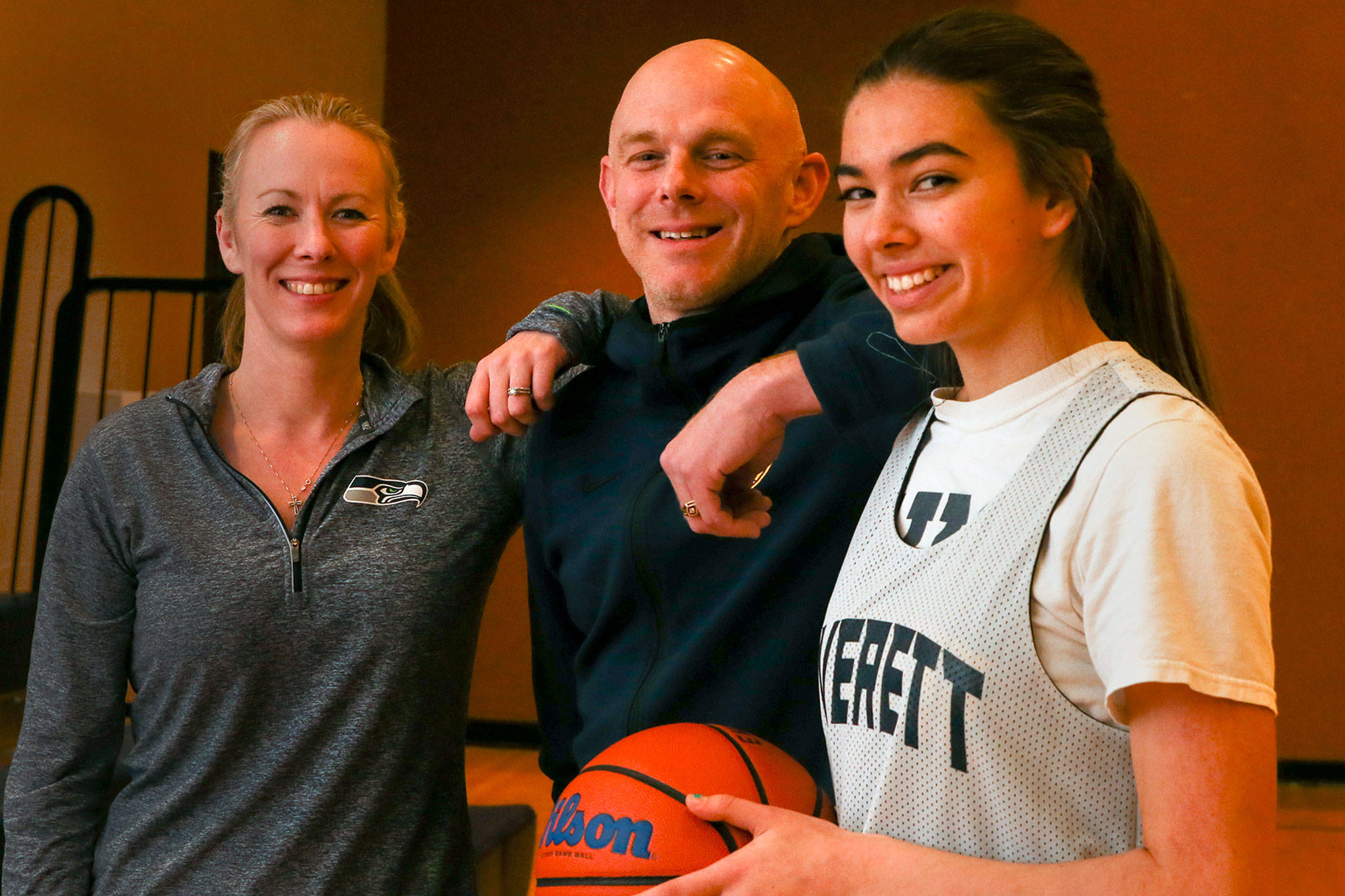 From left, Everett High School girls basketball coach Jeannie Thompson, her brother, boys basketball coach Bobby Thompson and Bobbys daughter Lilli, a varsity player for the Seagulls. (Kevin Clark / The Herald)