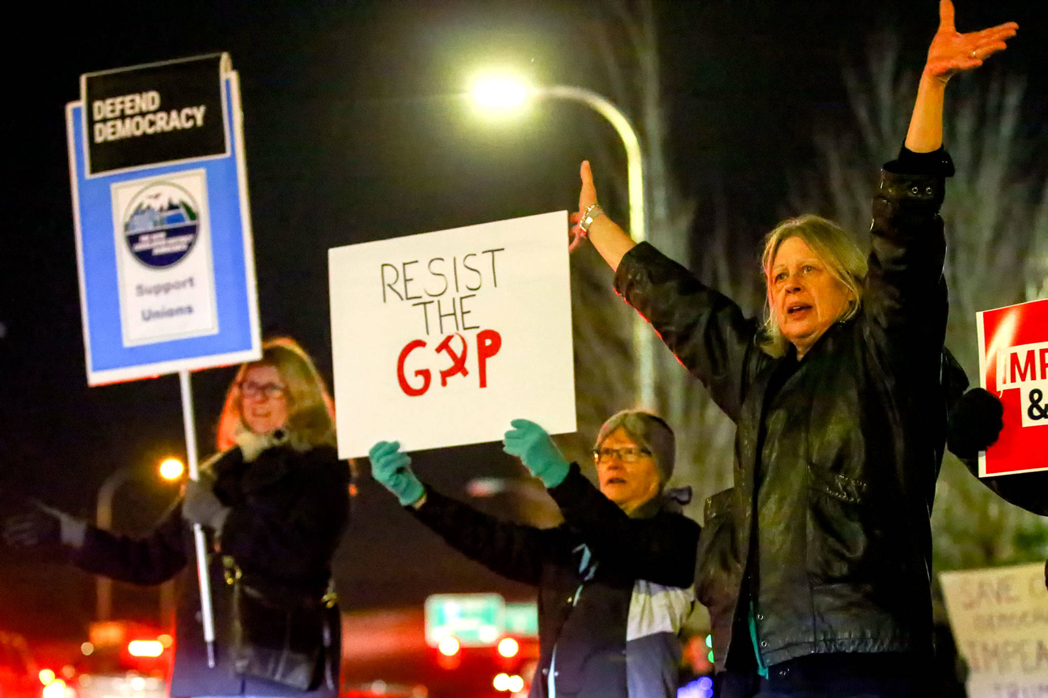 Hundreds gathered in support of the impeachment of President Donald Trump Tuesday evening along Broadway in Everett. (Kevin Clark / The Herald)