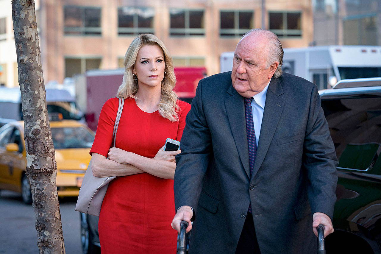 Charlize Theron plays Megyn Kelly and a fat makeup-swaddled John Lithgow is Roger Ailes in “Bombshell.” (Lionsgate)