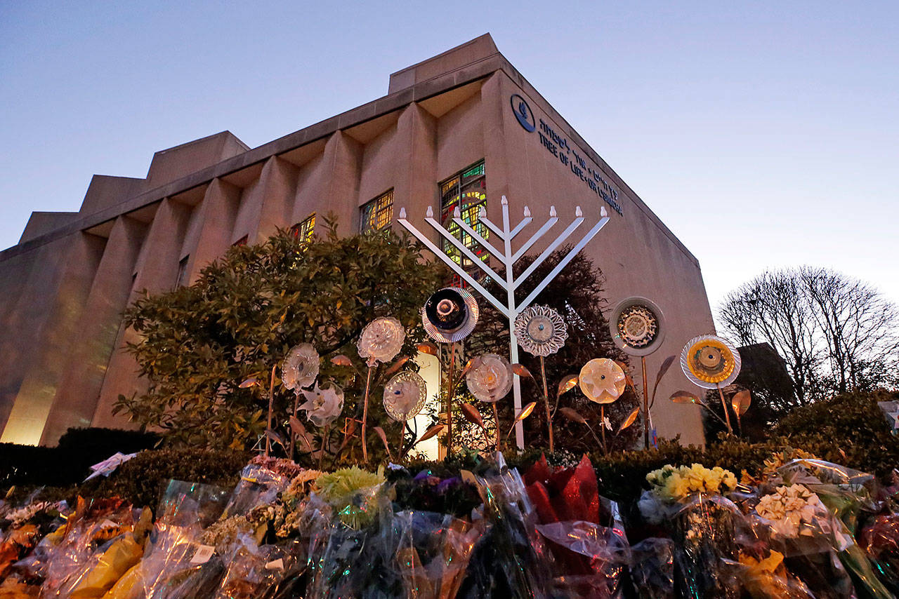 A menorah rises outside the Tree of Life Synagogue in preparation for a celebration service at sundown on the first night of Hanukkah in December 2018, in the Squirrel Hill neighborhood of Pittsburgh. A gunman shot and killed 11 people while they worshipped Saturday, Oct. 27, 2018 at the temple. (Gene J. Puskar / Associated Press file)