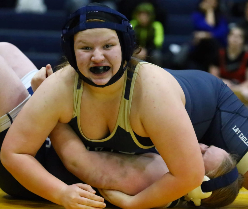 Arlington’s Brianna Williams-Bales wrestles and pins Glacier Peak’s Isabella Finch Wednesday evening at Arlington High School in Arlington on December 18, 2019. Arlington won 66-18. (Kevin Clark / The Herald)
