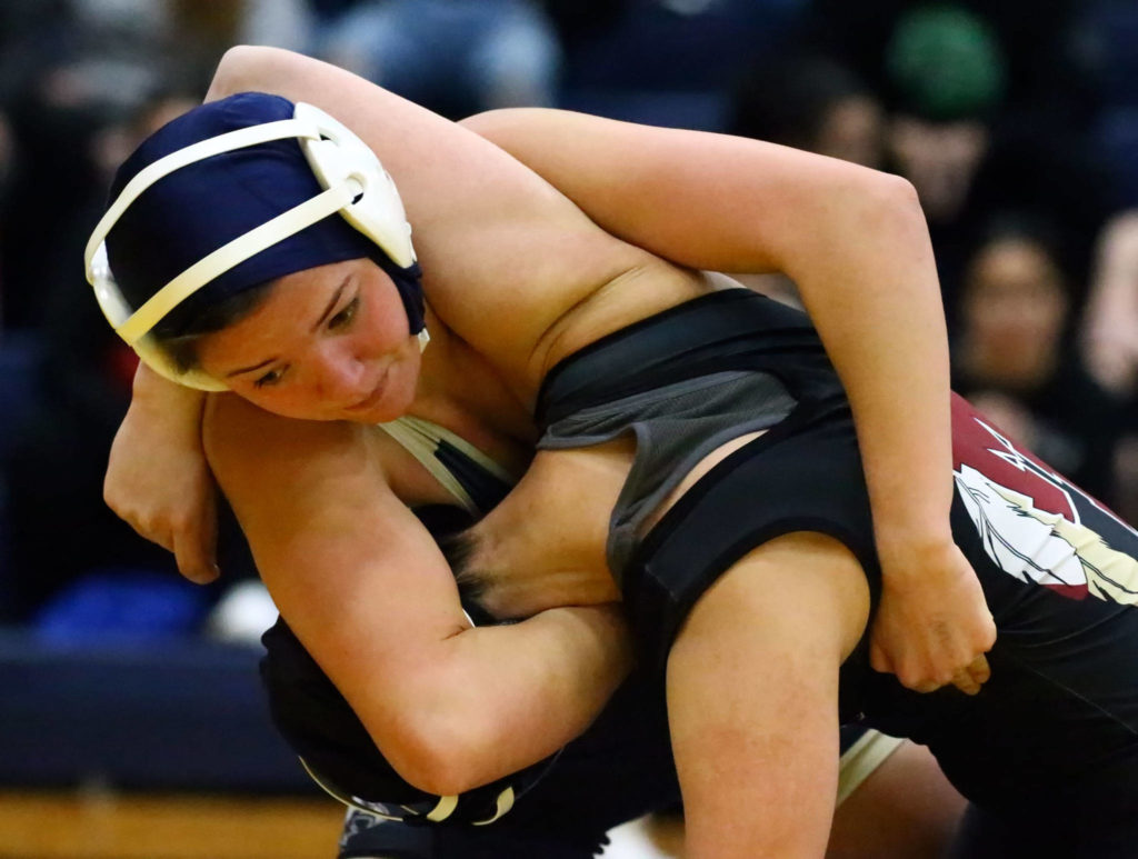 Arlington’s Tailer Cochran wrestles and pins Marysville Pilchuck’s Maria Ayala-Flores Wednesday evening at Arlington High School in Arlington on December 18, 2019. Arlington won 60-18. (Kevin Clark / The Herald)
