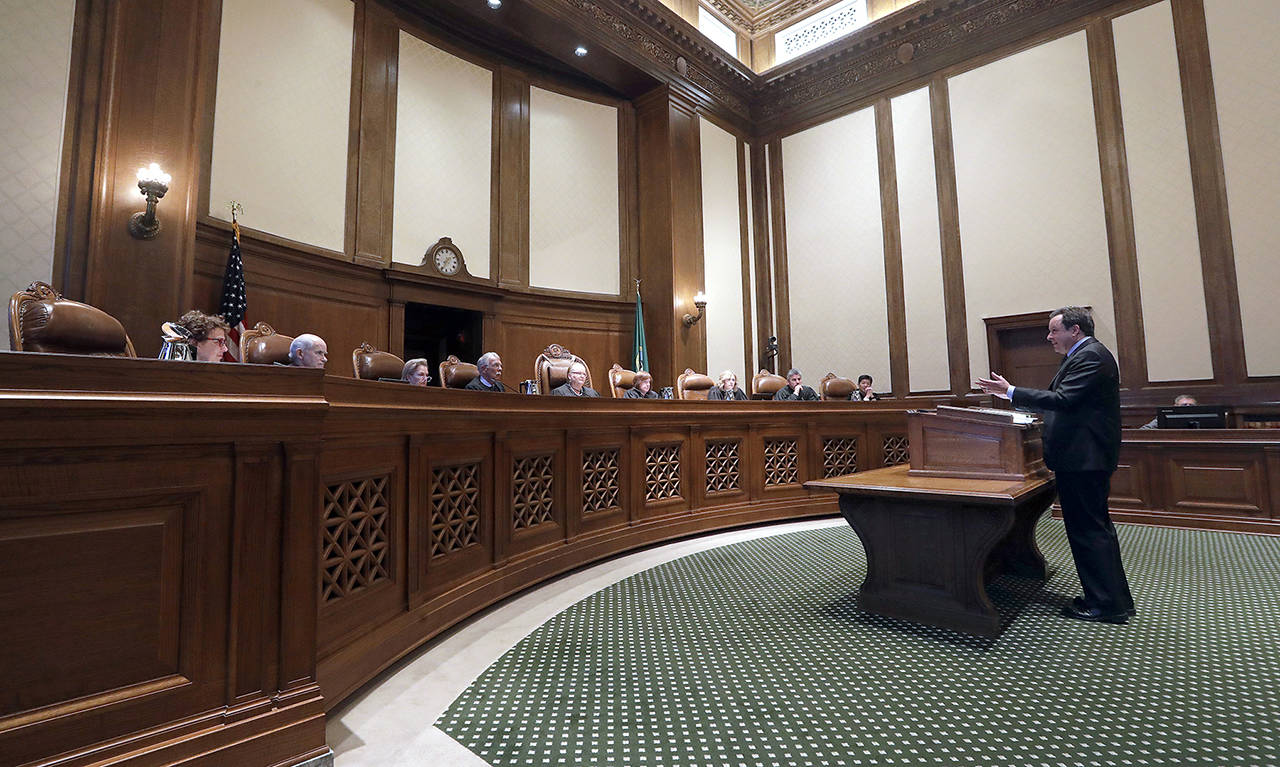 Paul J. Lawrence, attorney for the Legislature, addresses justices during a hearing before the Washington Supreme Court on June 11, 2019, in Olympia. (AP Photo/Elaine Thompson, file)