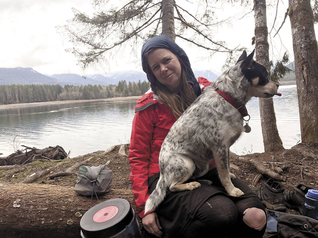 Jessi Loerch backpacked once a month for a year. Here, seen with James the dog, she is on a trip to Baker Lake. (Washington Trails Association)