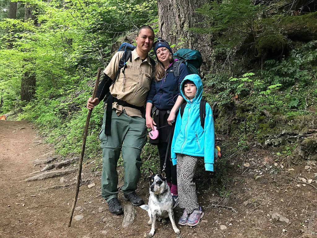 Jerry Weatherhogg, Jessi Loerch, Hazel Loerch and James the dog take a backpacking trip to Greenwater Lakes near Mount Rainier. (Washington Trails Association)
