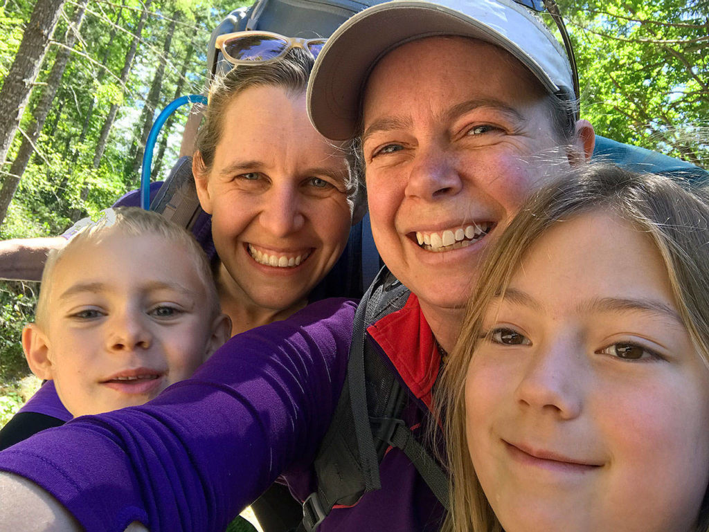 Quinn Allen, Stephanie Allen, Jessi Loerch and Hazel Loerch take a backpacking trip to Glacier Lake near Mount Rainier. A highlight for the kids is looking for frogs at the lake. (Washington Trails Association)

