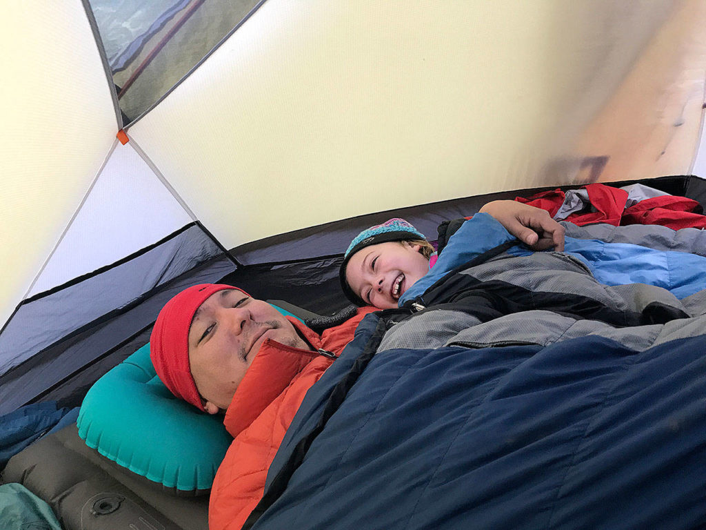 Jerry Weatherhogg and Hazel Loerch like warming up in the tent and reading books while backpacking. They’re seen here on a trip to Baker Lake. (Washington Trails Association)
