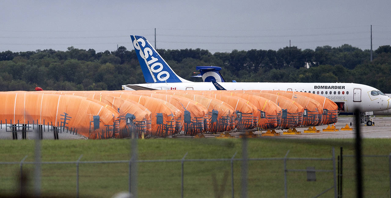 In this Oct. 3 photo, completed Boeing 737 Max fuselages, made at Spirit Aerosystems in Wichita, Kansas, sit covered in tarps near the factory. (Travis Heying/The Wichita Eagle via AP File)