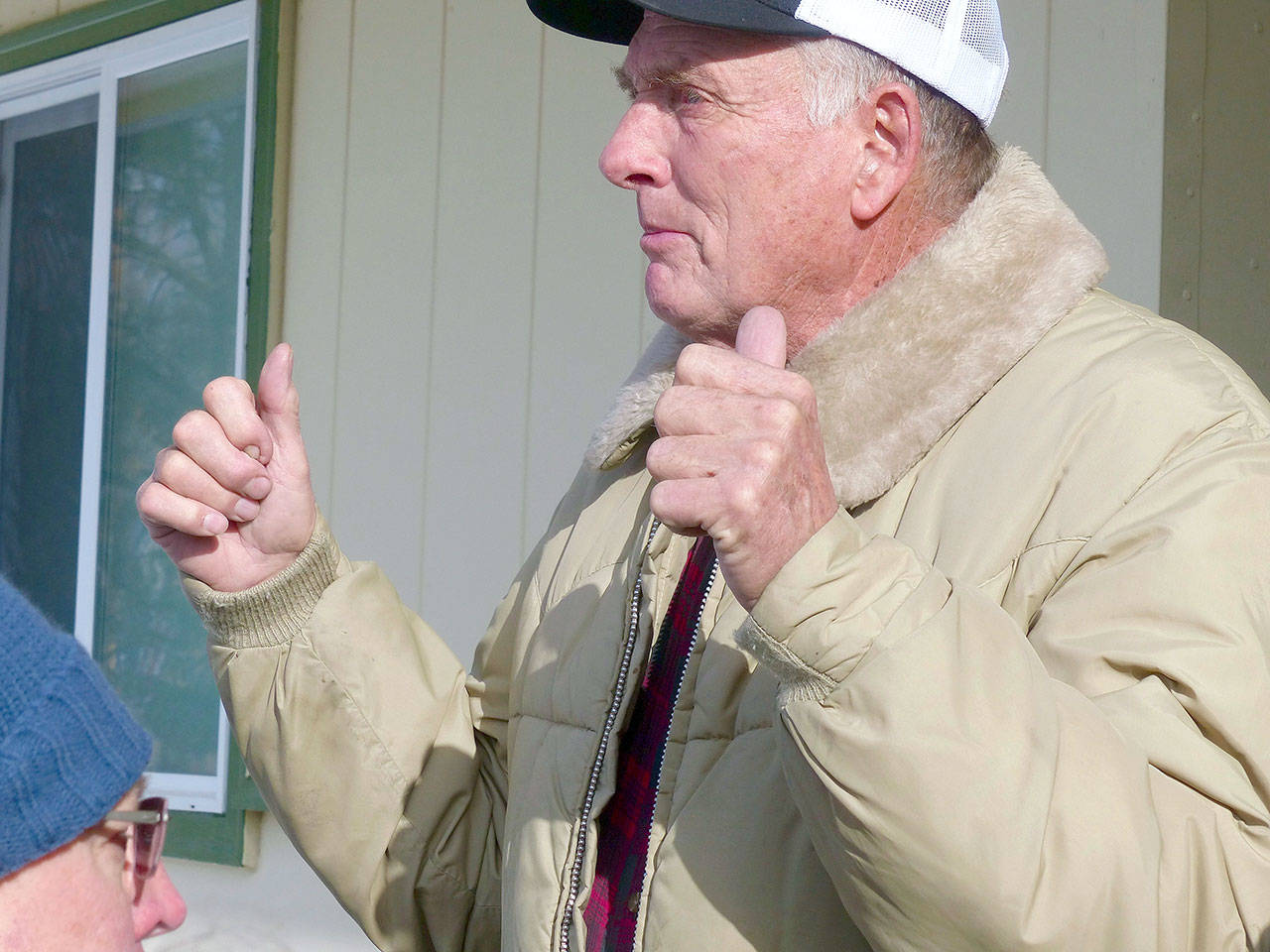 Rancher Dwight Hammond Jr. greets protesters outside his home in Burns, Oregon, on Jan. 2, 2016. A judge on Friday revoked the grazing permit of two ranchers who were pardoned last year by President Donald Trump on an arson conviction for setting fire to federal lands. (Les Zaitz/The Oregonian via AP, File)