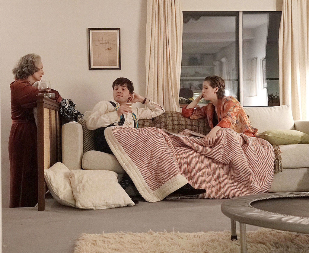 From left, Tilda Swinton, Tom Burke and Honor Swinton Byrne in “The Souvenir.” (A24)
