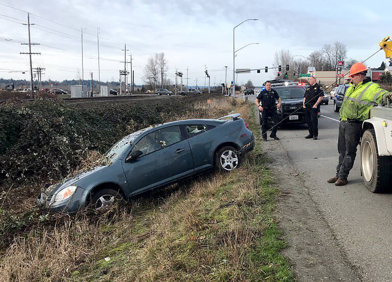 During a high-speed chase on Christmas Day, a woman drove over spike strips, lost control of her vehicle and went off the road on U.S. 2 near Monroe. (Monroe Police Department)