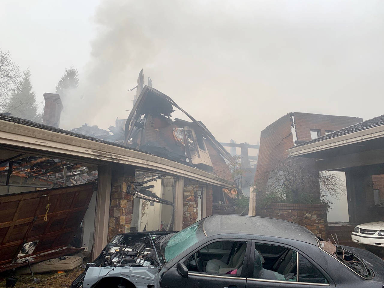 Crews were still working Thursday on the fire that collapsed a vacant 14,000-square-foot house on Fisher Road in Edmonds. (South County Fire)