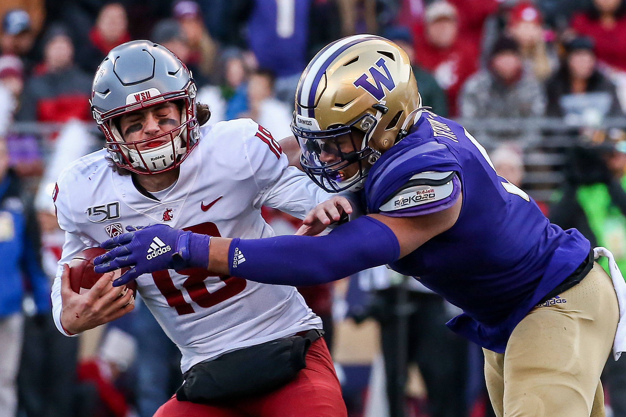 Washington State quarterback Anthony Gordon (18) is sacked by Washingtons Joe Tryon (9) during the 112th Apple Cup on Nov. 29 at Husky Stadium in Seattle. Gordon and the Cougars face Air Force in the Cheez-It Bowl on Friday. (Kevin Clark / The Herald)