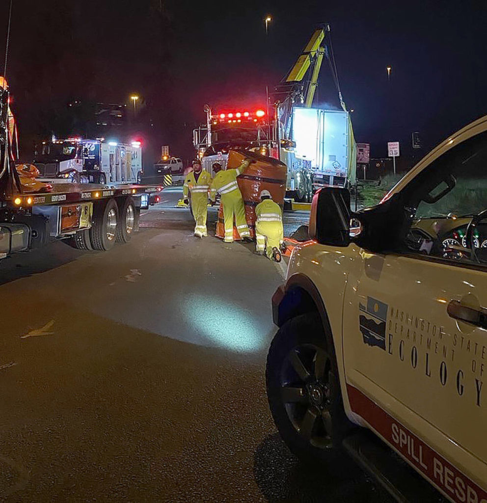 A tractor-trailer that overturned near 19th Ave. SE and SR 527 in Everett jammed up traffic for hours Friday night. (Everett Police Department)
