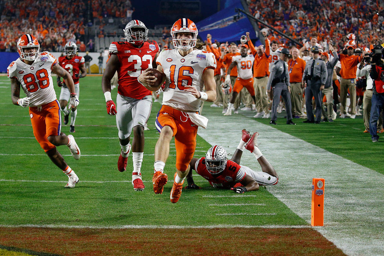 Clemson quarterback Trevor Lawrence runs in for a touchdown during the first half of the Fiesta Bowl against Ohio State on Saturday in Glendale, Ariz. (AP Photo/Ross D. Franklin)